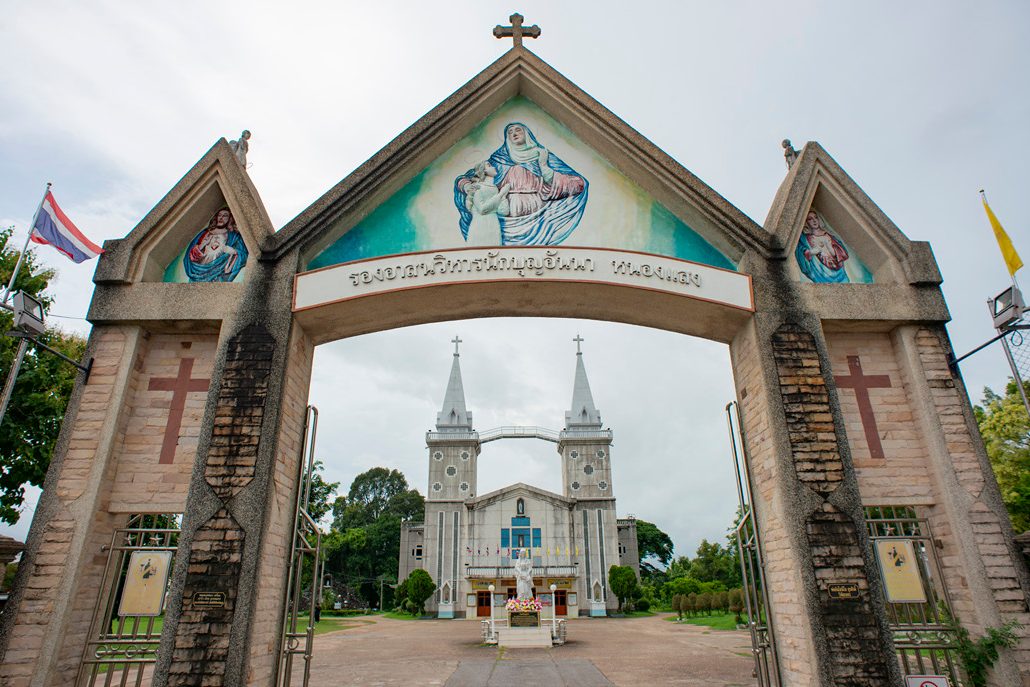Twin spires of Saint Anna Nong Saeng Church seen through its gate in Nakhon Phanom