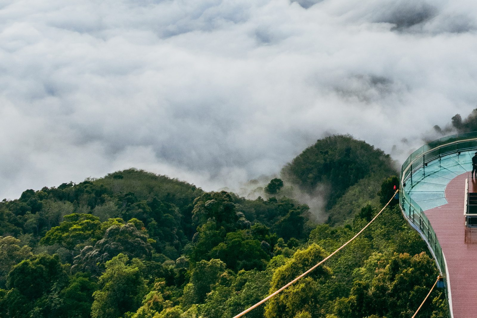 Skywalk Aiyerweng glass walkway above a sea of mist and forested hills in Betong, Yala